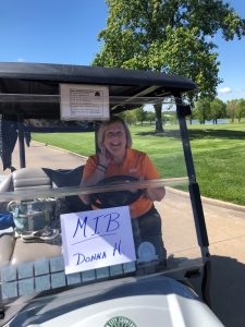 Donna in MIB golf cart