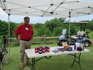 Joe Steil manning the MIB table at the MIB golf event