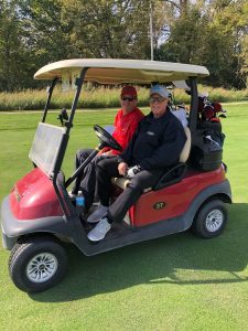 golfers in cart